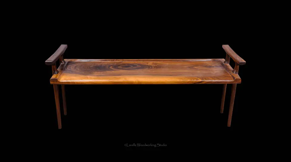 Selberg Bench in walnut with a hand-carved seat and dark armrests